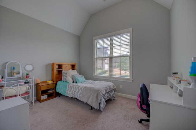 bedroom with carpet, baseboards, and lofted ceiling