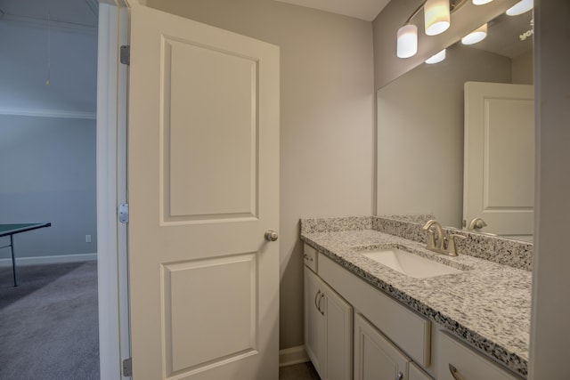 bathroom featuring baseboards and vanity