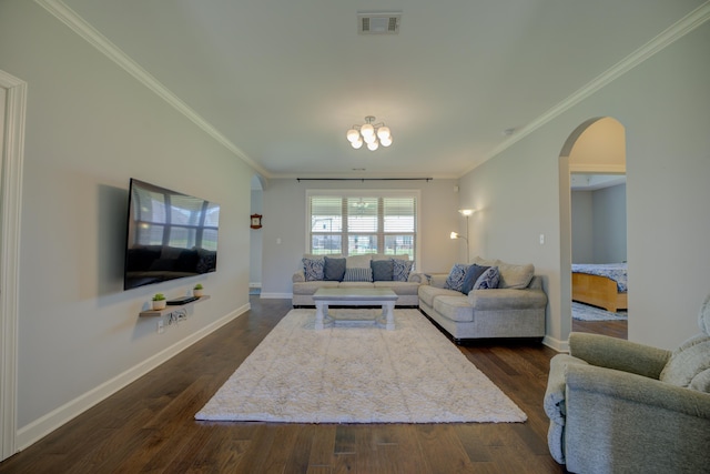 living area featuring arched walkways, ornamental molding, dark wood finished floors, and visible vents