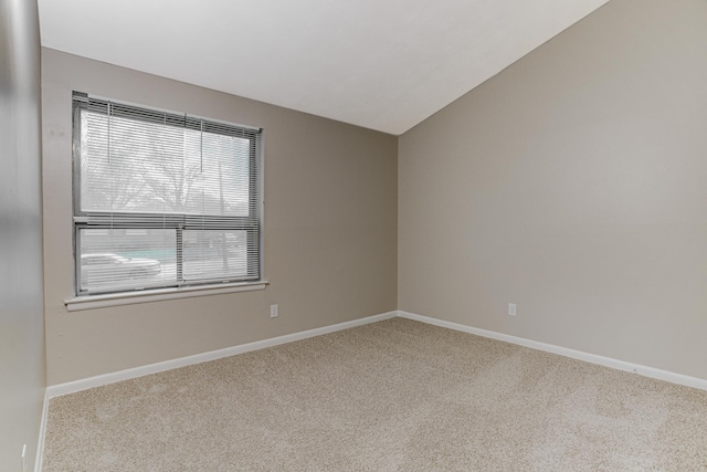 3562 Pueblo Ave, Memphis, TN 38127 - unfurnished room featuring carpet flooring, baseboards, and lofted ceiling