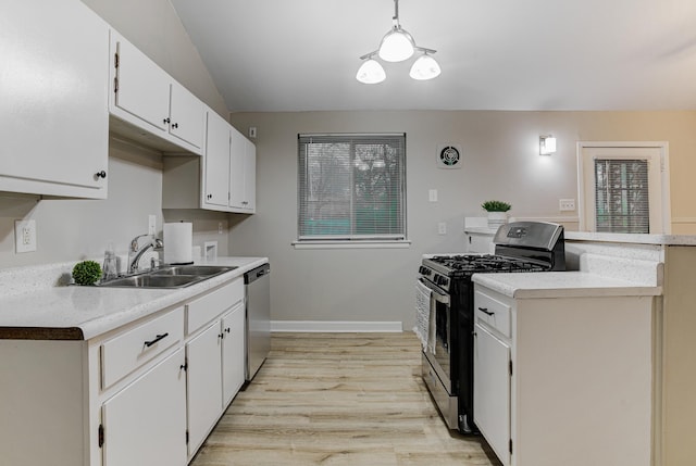 3562 Pueblo Ave, Memphis, TN 38127 - kitchen featuring light wood-style flooring, white cabinets, appliances with stainless steel finishes, light countertops, and a sink