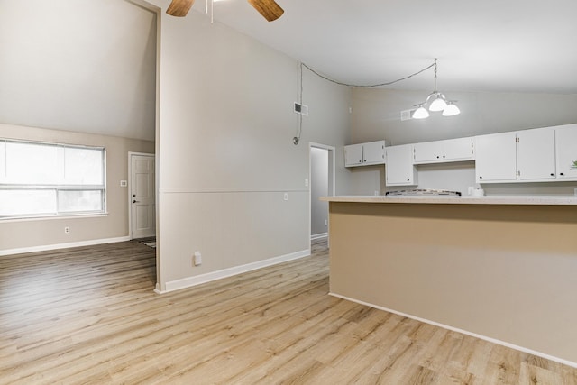 3562 Pueblo Ave, Memphis, TN 38127 - kitchen with baseboards, decorative light fixtures, a ceiling fan, white cabinetry, and light wood-style flooring