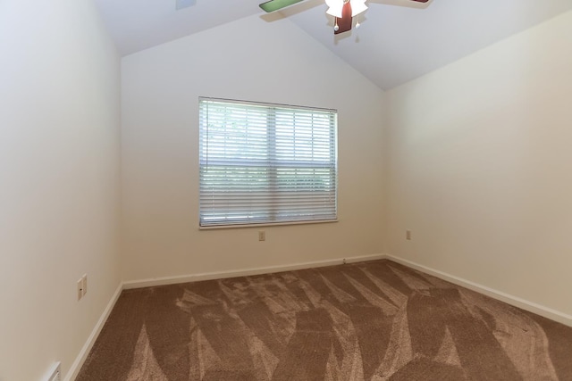 empty room featuring visible vents, baseboards, ceiling fan, carpet floors, and vaulted ceiling