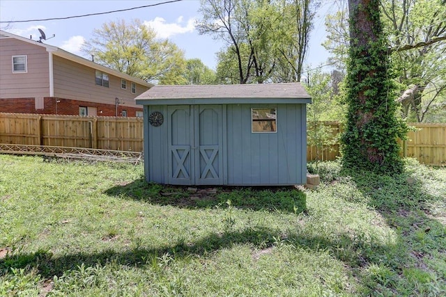 view of shed with a fenced backyard