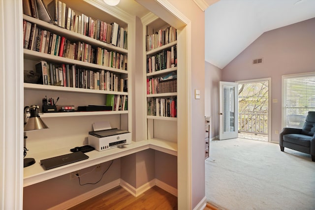 1005 River Currents Dr, Memphis, TN 38103 - interior space featuring wall of books, visible vents, vaulted ceiling, wood finished floors, and baseboards