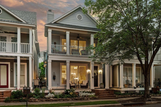 1005 River Currents Dr, Memphis, TN 38103 - rear view of house with covered porch, a balcony, a ceiling fan, and a chimney