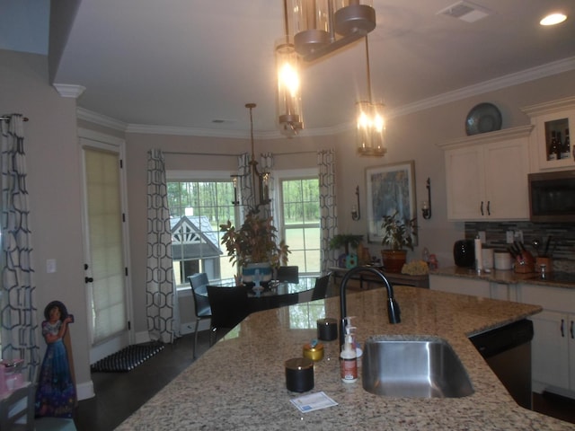 kitchen with visible vents, a notable chandelier, dishwasher, a sink, and stainless steel microwave