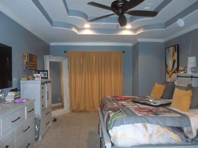 bedroom featuring ornamental molding, a raised ceiling, and light colored carpet