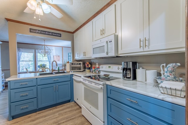 kitchen with white appliances, light wood-type flooring, white cabinets, blue cabinets, and a sink