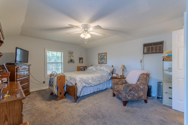 bedroom with carpet floors, a textured ceiling, lofted ceiling, and a wall unit AC