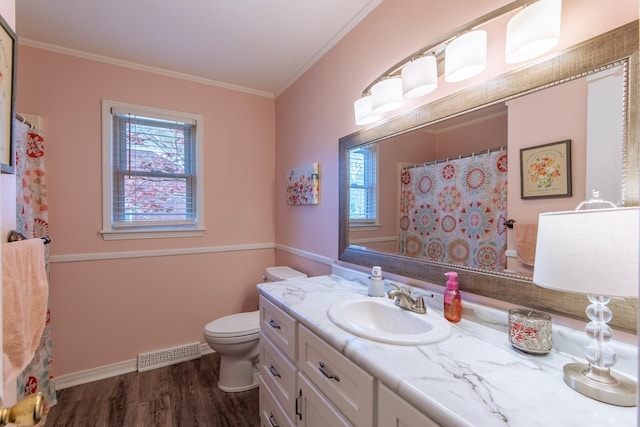full bath featuring visible vents, ornamental molding, toilet, vanity, and wood finished floors