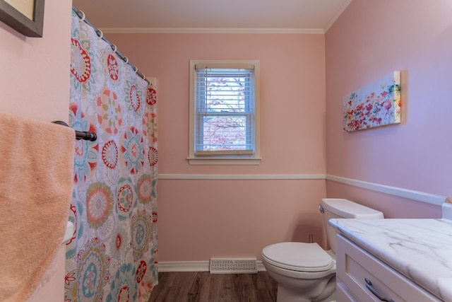 full bathroom featuring visible vents, curtained shower, toilet, crown molding, and wood finished floors