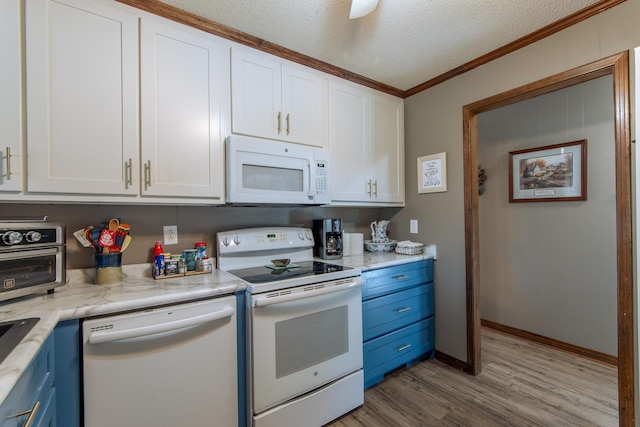 kitchen featuring white appliances, light wood-style flooring, white cabinetry, and blue cabinetry