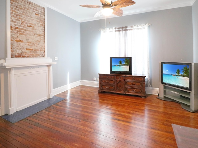 unfurnished living room featuring a ceiling fan, baseboards, ornamental molding, and hardwood / wood-style flooring