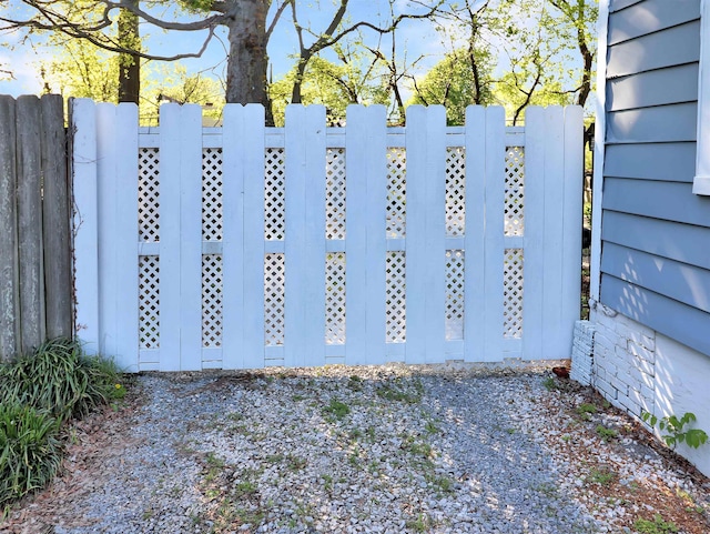 view of gate with fence