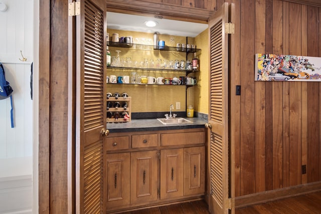 4252 Heatherwood Ln, Memphis, TN 38117 - bar with a sink, wet bar, dark wood-style flooring, and wood walls