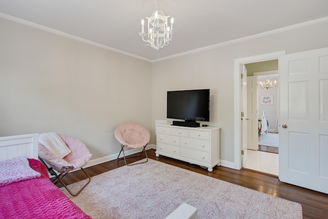 4252 Heatherwood Ln, Memphis, TN 38117 - bedroom featuring baseboards, ornamental molding, dark wood-style flooring, and a chandelier