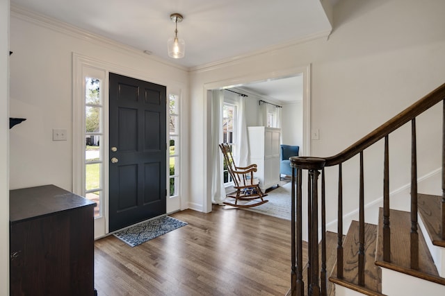 4252 Heatherwood Ln, Memphis, TN 38117 - entryway with crown molding, baseboards, wood finished floors, and stairway