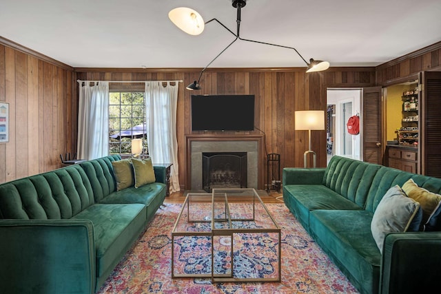 4252 Heatherwood Ln, Memphis, TN 38117 - living area featuring ornamental molding, a fireplace, and wood walls