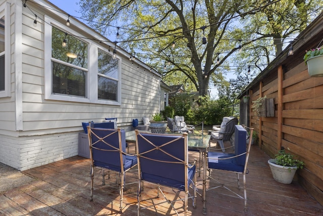 view of patio / terrace with outdoor dining space and a wooden deck