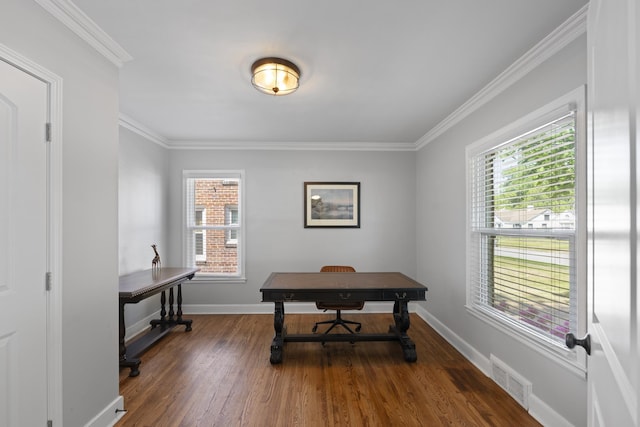 office space featuring crown molding, wood finished floors, visible vents, and plenty of natural light