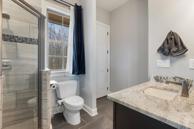 6742 Malone Rd, Olive Branch, MS 38654 - full bathroom with tile patterned flooring, vanity, a stall shower, and toilet