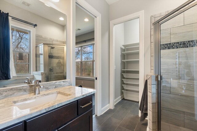 6742 Malone Rd, Olive Branch, MS 38654 - full bath featuring vanity, visible vents, recessed lighting, a stall shower, and baseboards