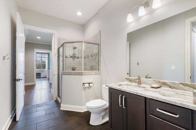 6742 Malone Rd, Olive Branch, MS 38654 - bathroom featuring a shower stall, vanity, recessed lighting, toilet, and baseboards
