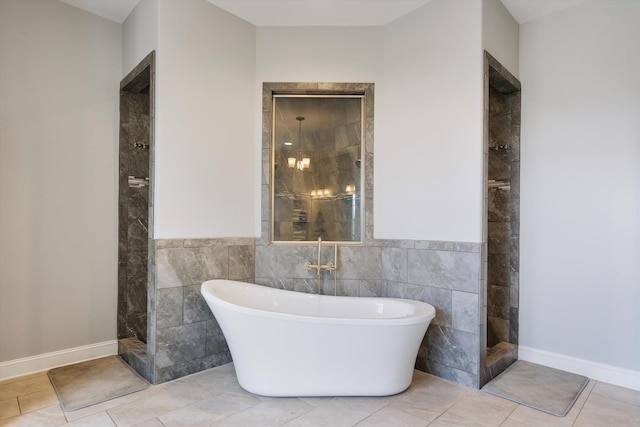 6742 Malone Rd, Olive Branch, MS 38654 - full bathroom featuring tile patterned flooring, tile walls, tiled shower, and a soaking tub