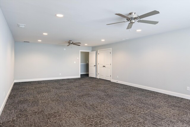 6742 Malone Rd, Olive Branch, MS 38654 - unfurnished room with visible vents, baseboards, dark carpet, ceiling fan, and recessed lighting