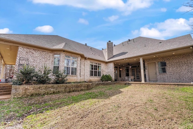 6742 Malone Rd, Olive Branch, MS 38654 - back of house with ceiling fan, a lawn, a patio area, brick siding, and a shingled roof