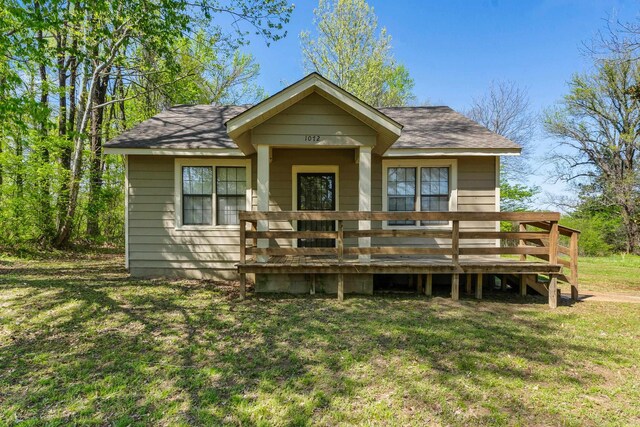 1072 Walk Rd, Memphis, TN 38109 - exterior space with a yard, a wooden deck, and roof with shingles