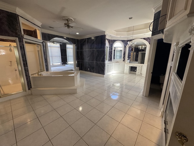 interior space with crown molding and light tile patterned floors