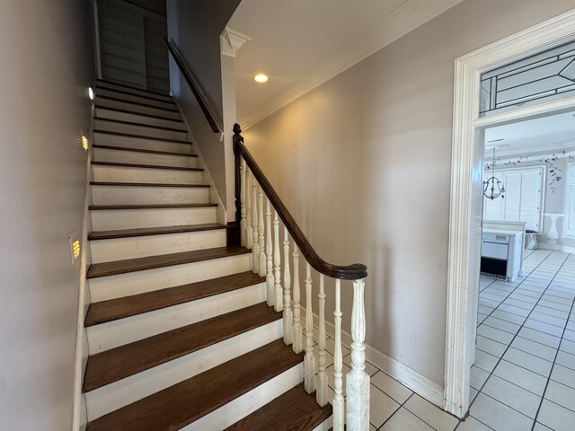 stairway with crown molding, baseboards, tile patterned flooring, and recessed lighting