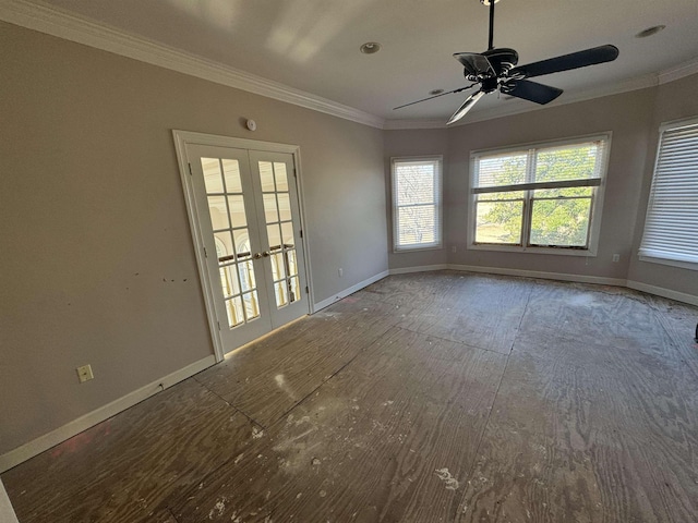 empty room with baseboards, crown molding, and a ceiling fan