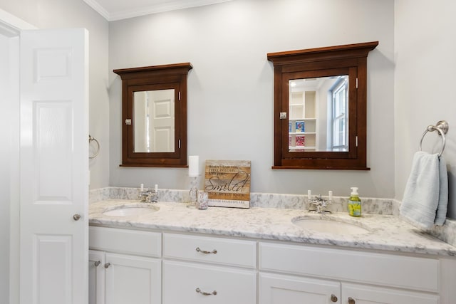 bathroom featuring a sink, ornamental molding, and double vanity