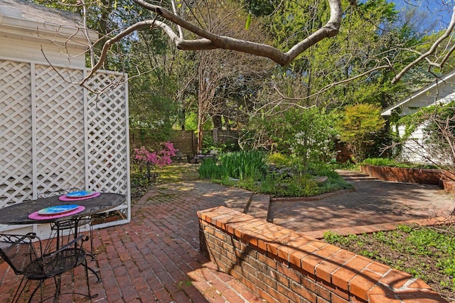 view of patio / terrace featuring fence