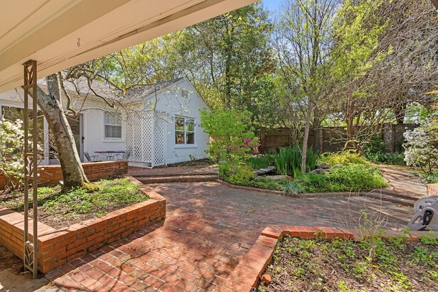 view of yard featuring a patio and fence