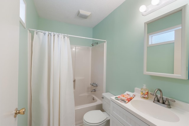 full bath featuring a textured ceiling, vanity, visible vents, toilet, and shower / bath combo with shower curtain