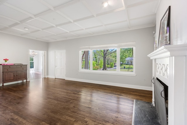 unfurnished living room featuring dark wood-type flooring, a fireplace with flush hearth, a chandelier, coffered ceiling, and baseboards