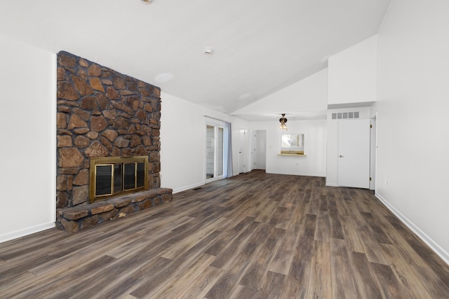 unfurnished living room featuring wood finished floors, a stone fireplace, high vaulted ceiling, and baseboards