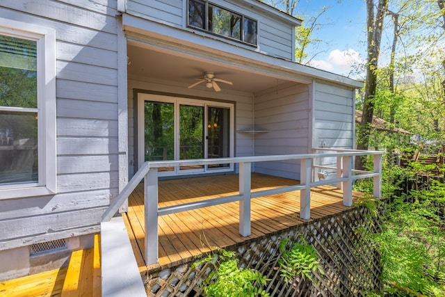 wooden deck featuring ceiling fan