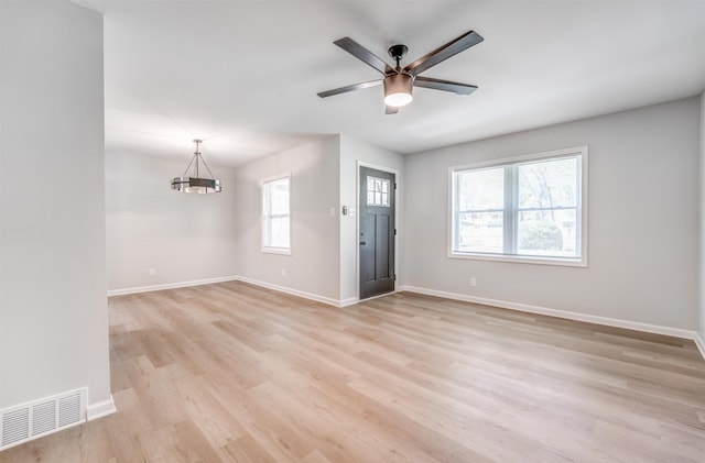 3191 Scenic Hwy, Memphis, TN 38128 - interior space featuring visible vents, light wood-style flooring, baseboards, and ceiling fan with notable chandelier
