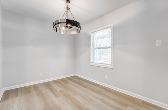 3191 Scenic Hwy, Memphis, TN 38128 - empty room featuring baseboards, an inviting chandelier, and wood finished floors