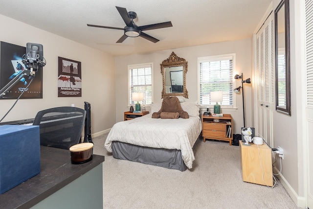 5718 Quince Rd Unit 4, Memphis, TN 38119 - bedroom featuring baseboards, multiple windows, carpet, and a textured ceiling