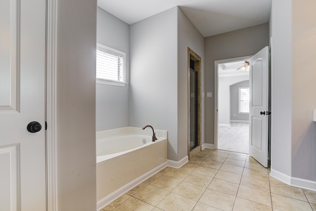bathroom with tile patterned floors, a bath, a shower stall, and ceiling fan