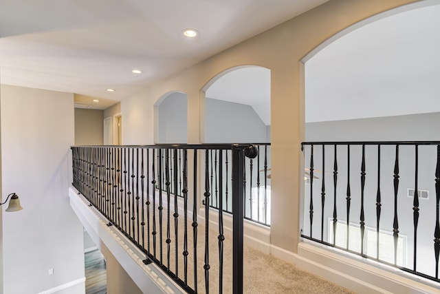 corridor featuring baseboards and recessed lighting