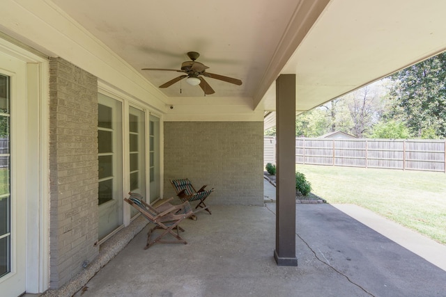 view of patio / terrace featuring ceiling fan and fence