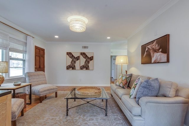 living area with crown molding, baseboards, visible vents, and recessed lighting