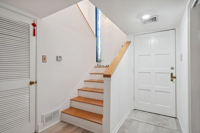 433 S Perkins Dr Unit 433, Memphis, TN 38117 - stairs with visible vents, baseboards, and wood finished floors